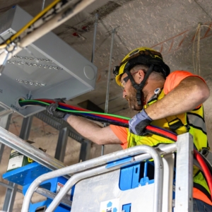 Electrician wires lighting.