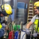 Two electricians working in a commercial building