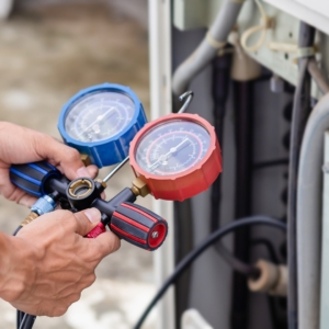 Technician reading an electrical meter.