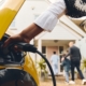 Woman charges her electric vehicle outside of her home.