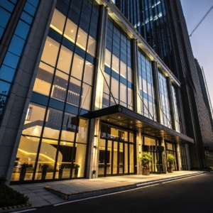 Exterior of a modern office building with large windows.