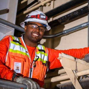 Electrician in safety gear.