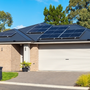 Solar panels on the roof of a home above the garage and front entrance.