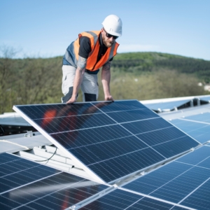 Electrician installing solar panels.