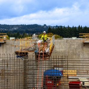 Construction worksite with rebar, concrete, and equipment.