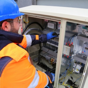 Residential electrician updates a complex system.