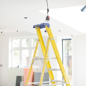Yellow ladder in living room.