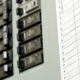 Home electrical panel with switches and circuit breakers.
