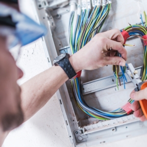 Residential electrician installing wiring in a home.
