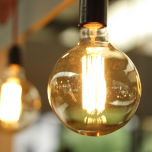 Hanging light bulb with amber glass.