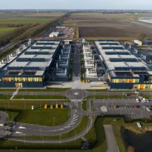 Industrial buildings in green field.