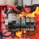 Red electrical panel on fire.