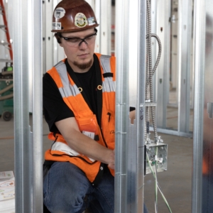 Electrician installing conduit in a commercial building.
