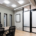 Office with conference table and black chairs.