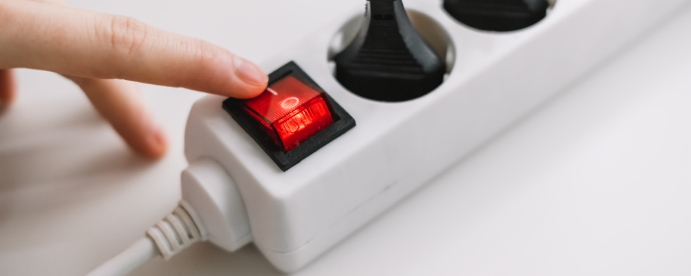 Power strip with red switch.