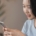 Woman looking at cell phone.