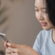 Woman looking at cell phone.