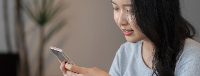Woman looking at cell phone.