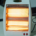 An image of a space heater with glowing heating elements.