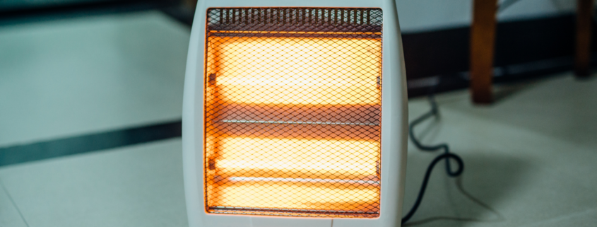 An image of a space heater with glowing heating elements.