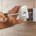 A close-up image of a person using a screwdriver to install a GFCI outlet.